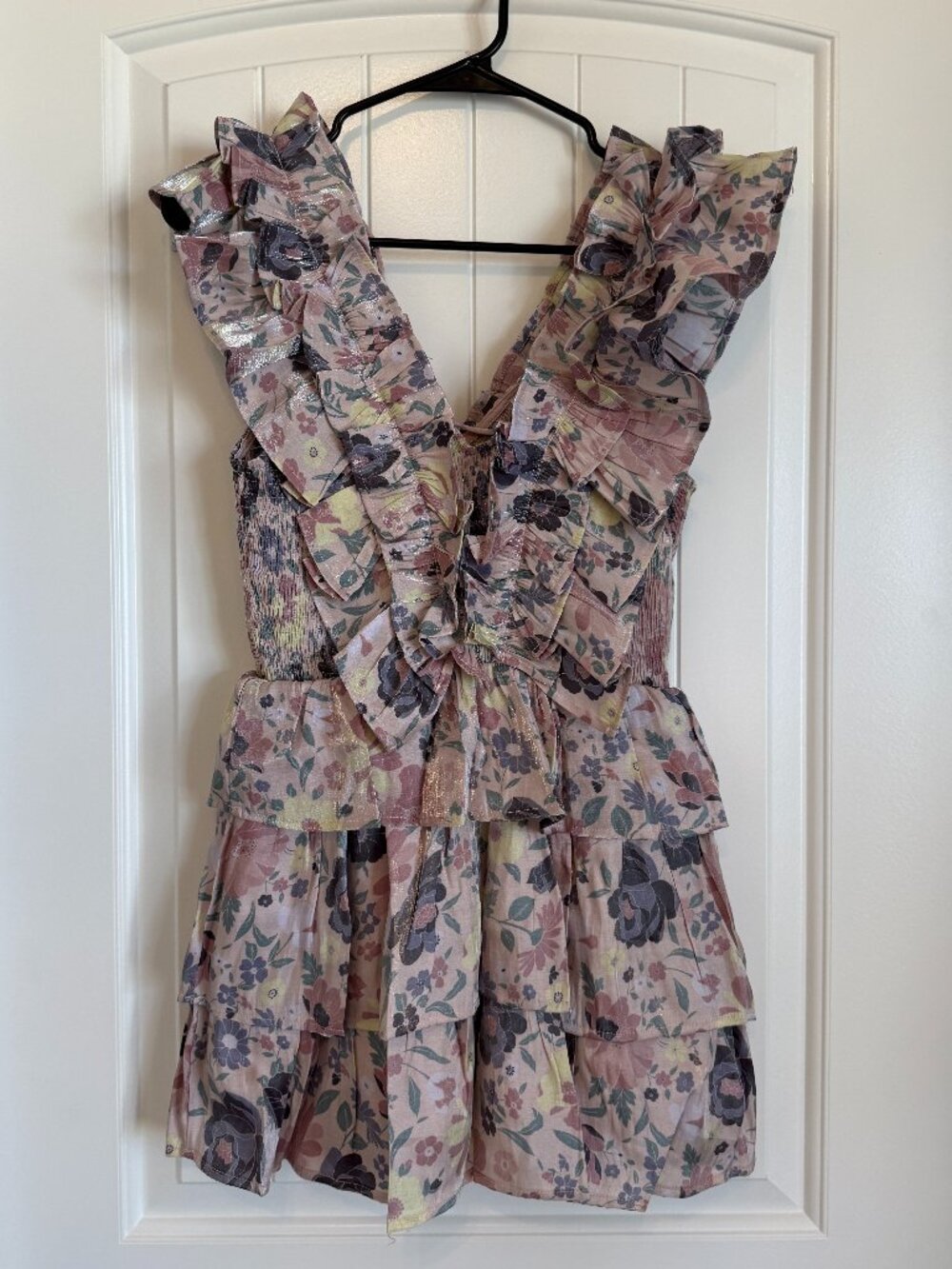 Karlie tiered floral mini dress featuring ruffle details.